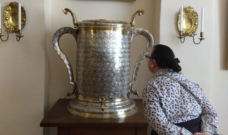 A BHA member examining a silver ceremonial vessel inside Schloss K&ouml;nigs Wusterhausen