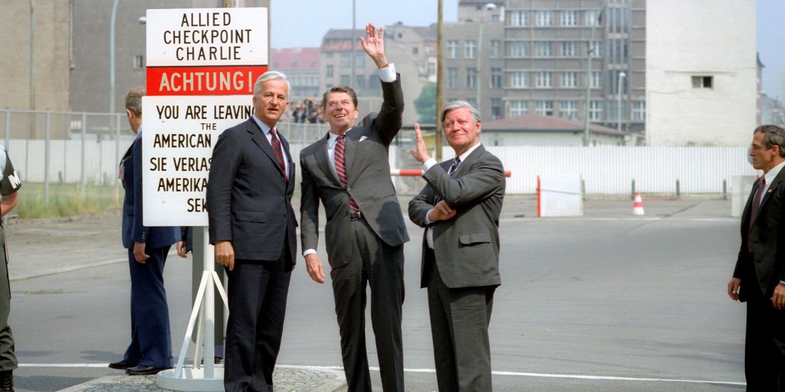 President Reagan waving beside Chancellor Schmidt and Mayor von Weizsäcker at Checkpoint Charlie, June 1982